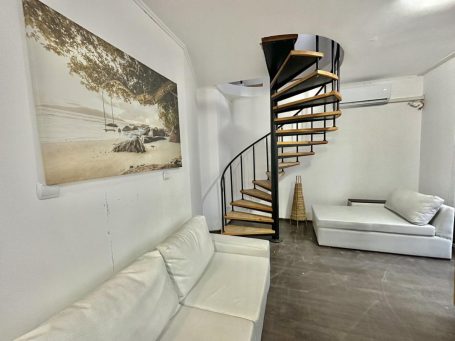 ID 692 Living room with stairs to the second floor